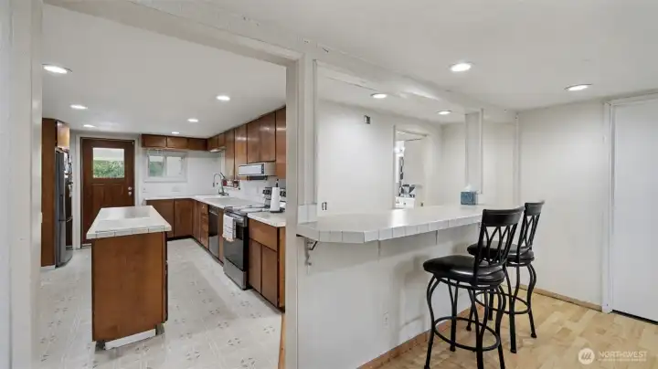 Convenient serving bar connects the kitchen to the dining area—perfect for casual meals or entertaining.