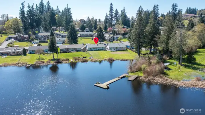 Home is located just a few homes down from community park and dock.