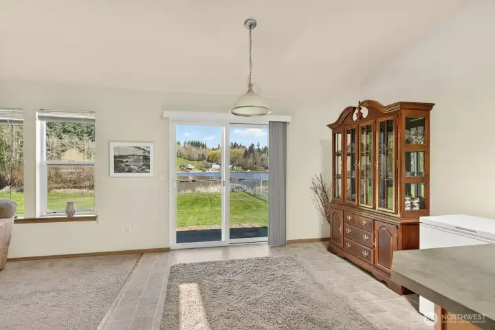 Spacious dining room off of kitchen with access to backyard.