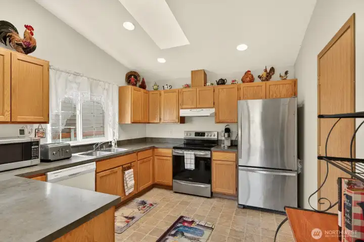 The kitchen has tons of cabinets and pantry! Endless storage space.