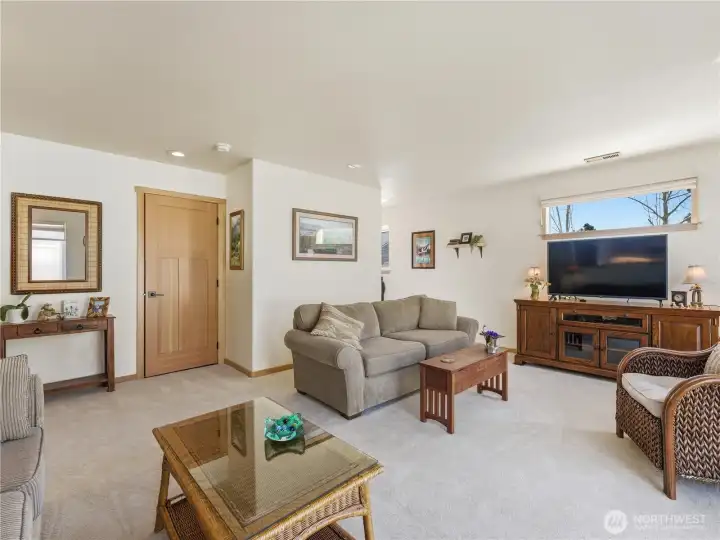 Fresh carpet in the family room creates a warm, comfortable retreat with direct access to the Trex deck for seamless indoor-outdoor living and entertaining