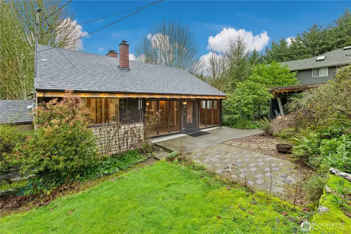 Enjoy the patio and mature landscaping in the front yard.