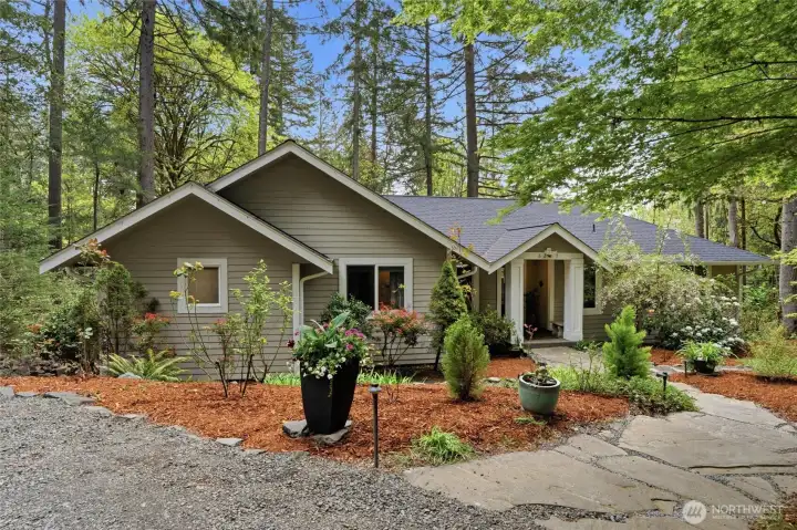 Tucked in the trees, this home feels like a retreat the minute you enter.