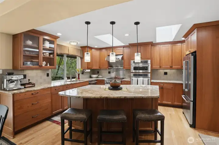 What a kitchen! This is chef's delight and a baker's dream.There are plenty of cabinets for storage & granite countertops for spreading out, all enhanced by the oak flooring, SS appliances, can lighting, and double ovens.