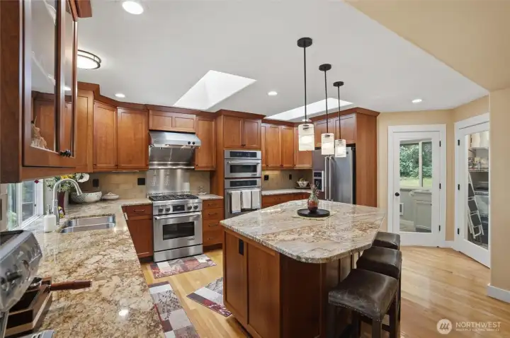 Off to the right of the kitchen are two see-through doors, one to the utility room and one to the walk-in pantry.