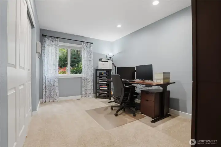 There are 2 bedrooms on the main level, including the primary suite. This bedroom is currently used as an office.