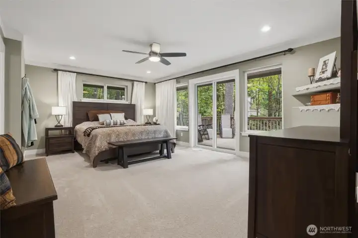 The primary suite is large enough for a king-sized bed and other furnishings. The private deck off this room allows for early morning bird watching or evening reading and relaxing.  A ceiling fan and can lighting enhance this lovely, spacious bedroom.