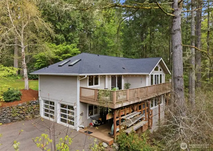 There is plenty of parking at this home. The 2-car garage has newer doors with windows that add a ton of light to the inside. There is outdoor parking in this driveway as well as the driveway in front of the home.