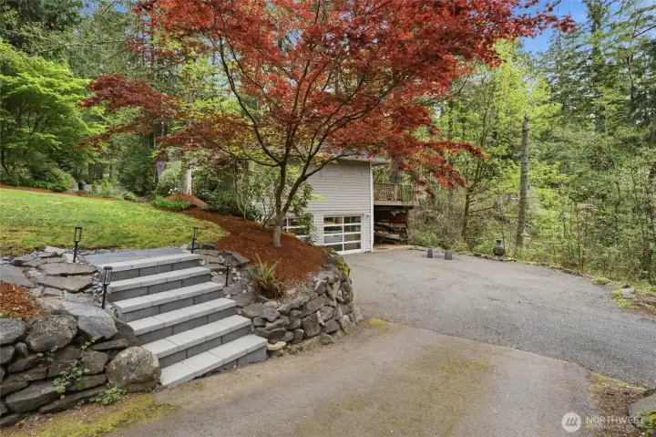 There are 2 driveways for this home, one leading to the 2-car garage, and a circular driveway up top.