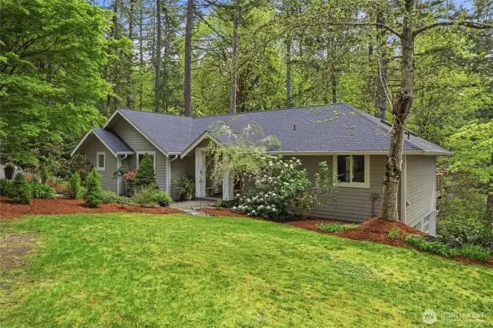 The yard is low-maintenance and beautifully landscaped.