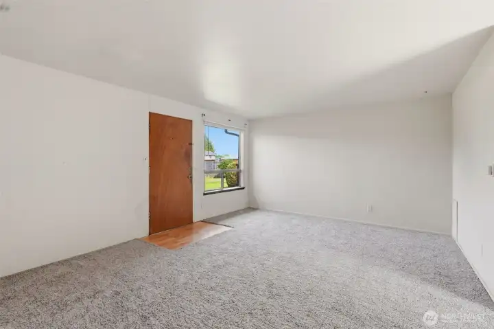 The 2 bedroom apartment living room. This unit has new carpet and interior paint.
