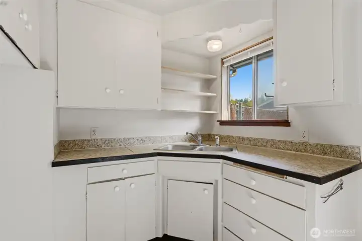 Kitchen with a sink above the window.