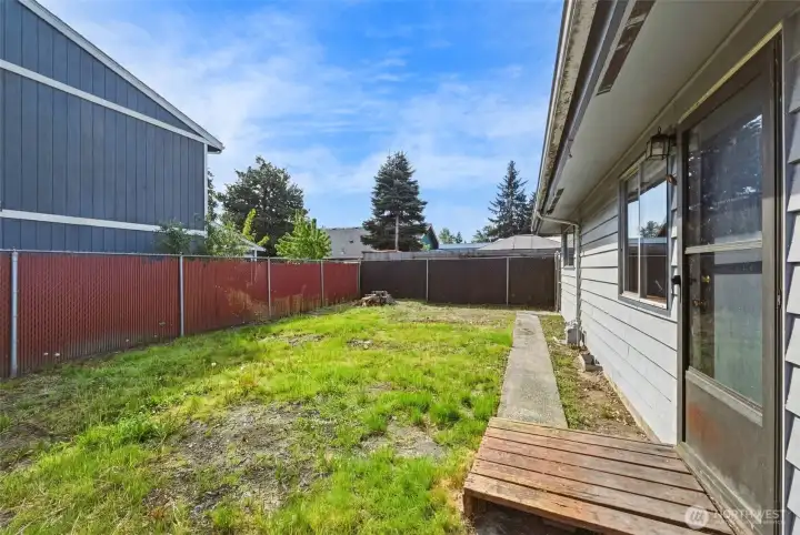 This apartment opens onto a fully fenced backyard!