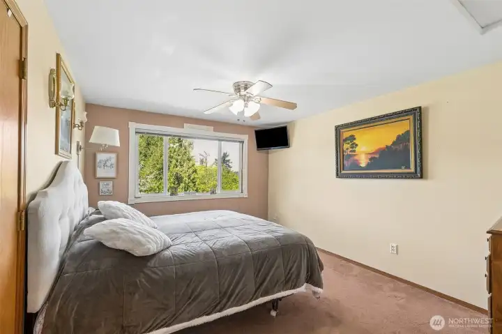 Primary upstairs suite overlooks the territorial view with a walk-in closet. Primary upstairs suite overlooks the territorial view with a walk-in closet.