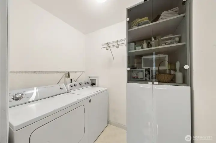 This home offers TWO separate size laundry area- one on the main floor (pictured here) and another full size laundry room upstairs. This home offers TWO separate size laundry area- one on the main floor (pictured here) and another full size laundry room upstairs.