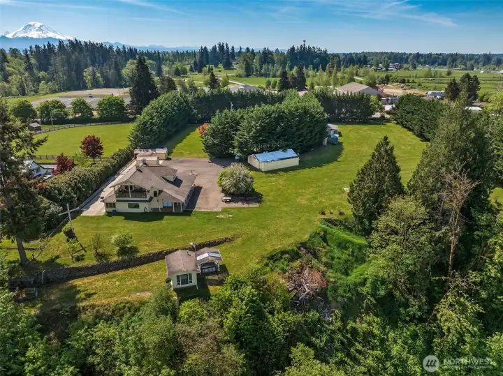 View looking southeast- this view shows the barn for extra covered parking & storage options. Across the street is a 43 acre equestrian facility with 1/4 mile track, boarding and several indoor arenas. View looking southeast- this view shows the barn for extra covered parking & storage options. Across the street is a 43 acre equestrian facility with 1/4 mile track, boarding and several indoor arenas.