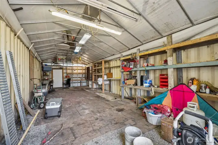 Located between two 40' shipping containers this covered area would also make a perfect shop or garage space to park cars. Located between two 40' shipping containers this covered area would also make a perfect shop or garage space to park cars.