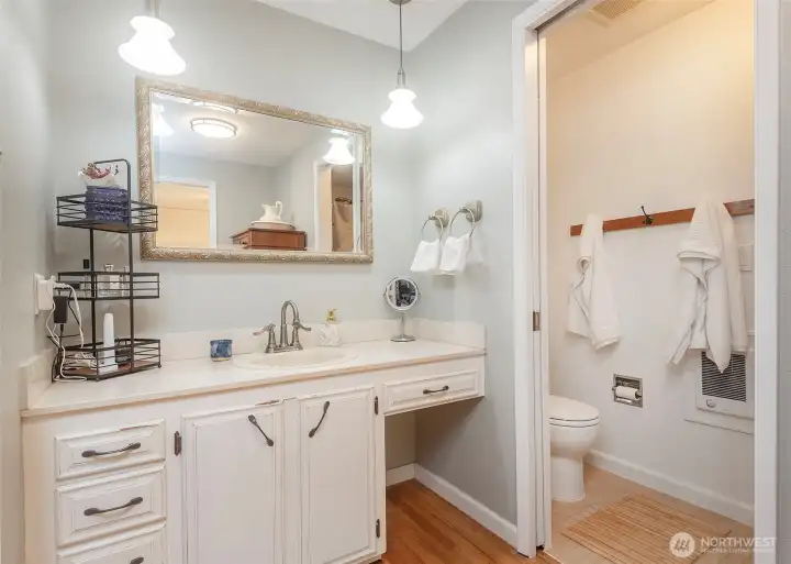 Primary ensuite with convenient door to separate spaces.