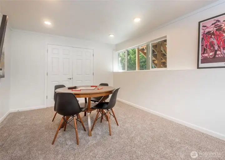 Another area in the spacious lower level living space. Doors lead to a huge, finished storage room with additional laundry hook ups.