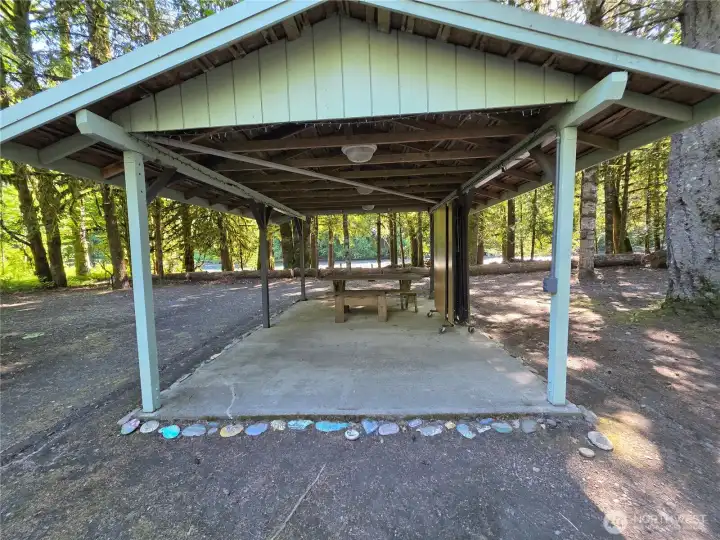 covered picnic shelter with cement floor. Plug in extension cord for electricity to shelter