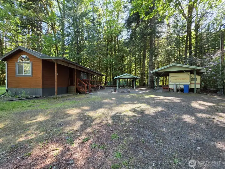 home, fire pit, travel trailer, covered picnic shelter