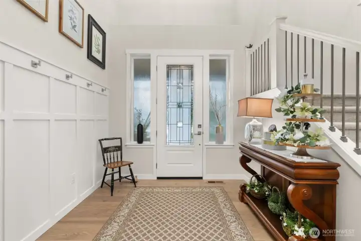 Spacious Foyer with Hardwood Floors and Wainscot. Spacious Foyer with Hardwood Floors and Wainscot.