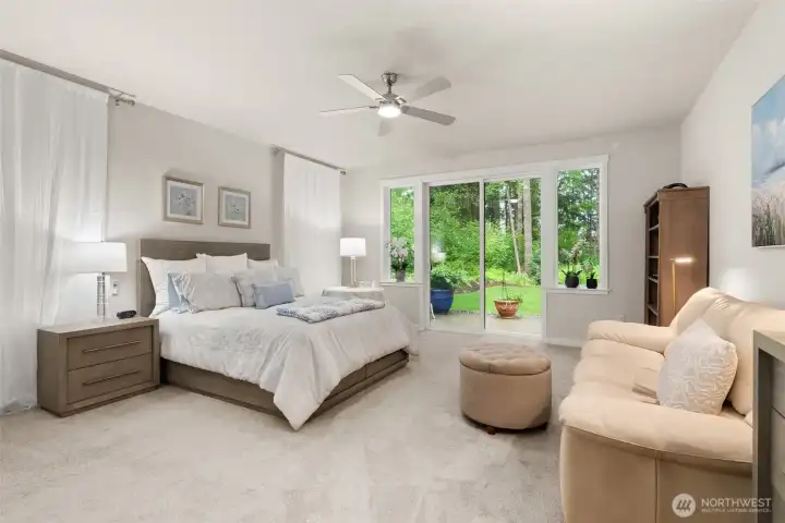 Main Floor Primary is spacious and tranquil with access to the back yard with private and territorial views Main Floor Primary is spacious and tranquil with access to the back yard with private and territorial views