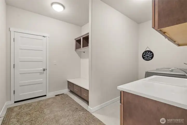 Functional Mud room and Laundry room with custom built in shelves + cubbies Functional Mud room and Laundry room with custom built in shelves + cubbies
