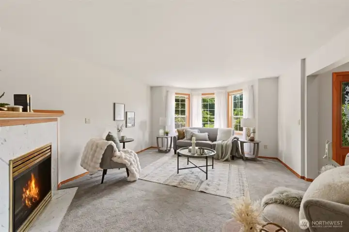 Enjoy beautiful bay windows in the living room as well as a cozy gas fireplace. Enjoy beautiful bay windows in the living room as well as a cozy gas fireplace.