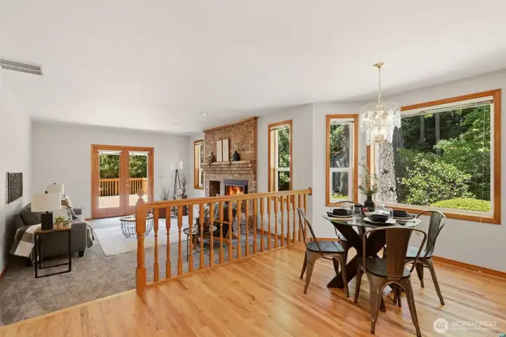 The kitchen and dining nook overlook as cozy family room with a door out to a beautiful back deck. The kitchen and dining nook overlook as cozy family room with a door out to a beautiful back deck.