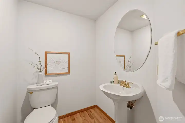 This charming powder room is located on the first floor. This charming powder room is located on the first floor.