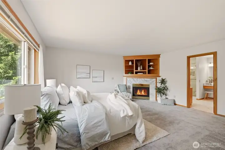 The enormous primary bedroom offers a fireplace with built-ins for a TV! The enormous primary bedroom offers a fireplace with built-ins for a TV!