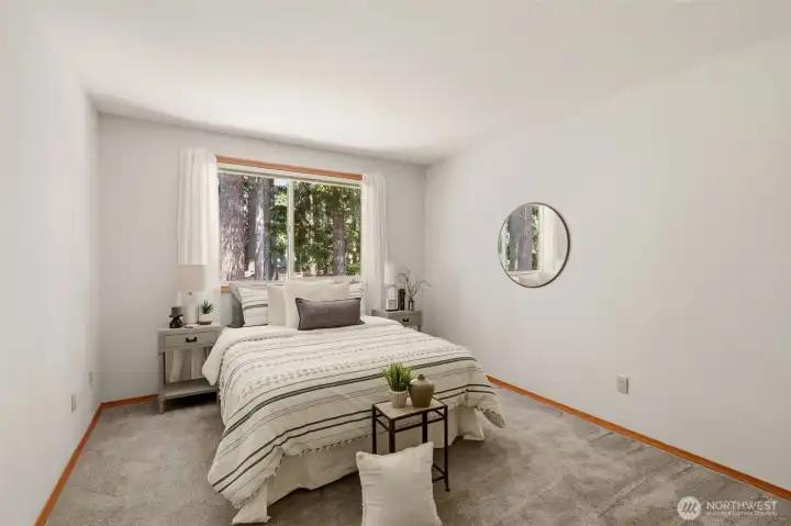 The second upstairs bedroom is large and looks out over the backyard. The second upstairs bedroom is large and looks out over the backyard.
