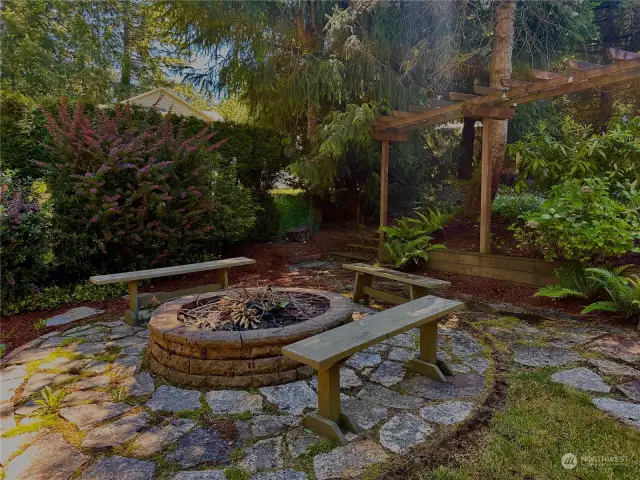 The fire pit is located off of the side yard and is very private