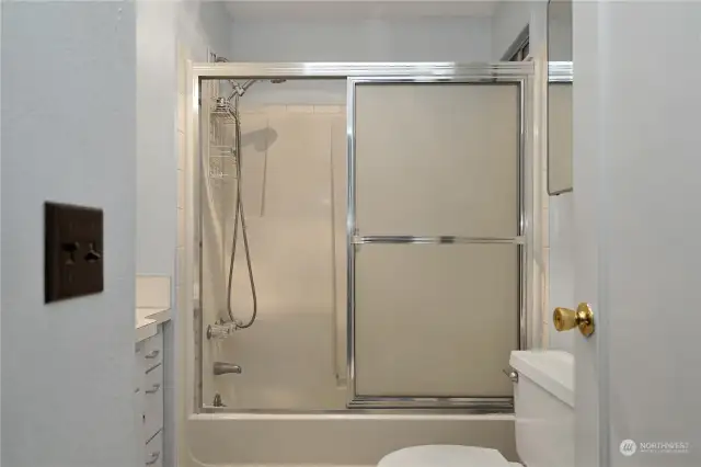 Full Bathroom on main floor in the hallway of the primary bedroom and an additional bedroom.