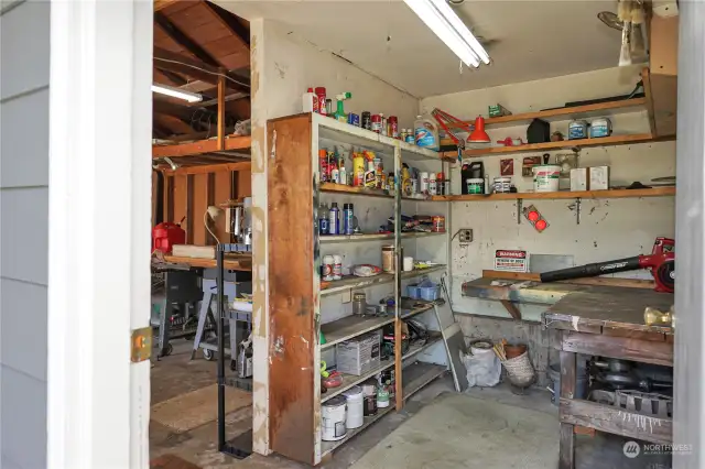 The shop room located just off the main garage. You can enter the shop area through it's own door as well.