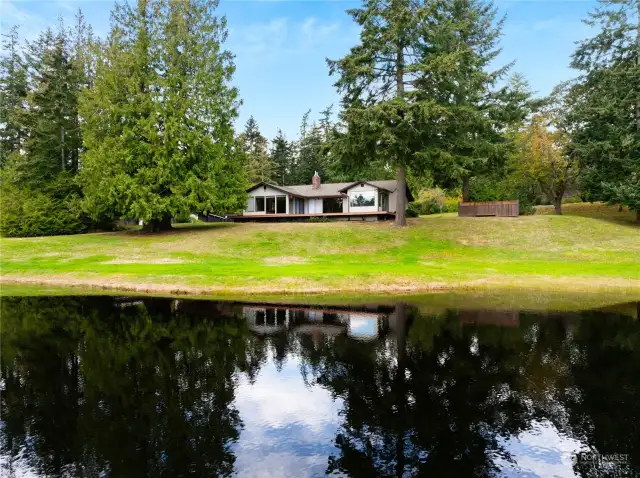 Picture perfect setting in this 14+ acre private retreat.