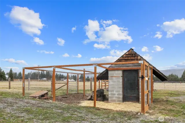 The fenced chicken coop is ready for your feathered friends! There is also storage space here for farm implements, + a composting area.