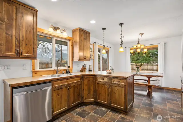 Great layout of the custom kitchen with dining space adjacent.