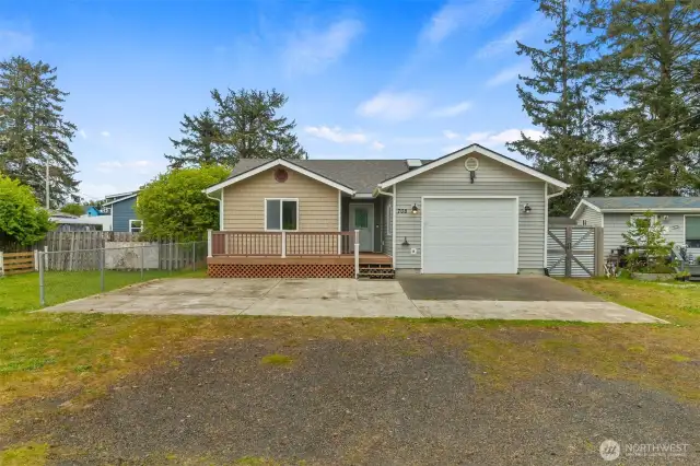 Home has enough room in front to park an RV and several cars. Has trek deck in front and covered entrance.