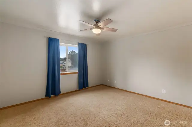 Bedroom towards the front of the home with  ceiling fan.