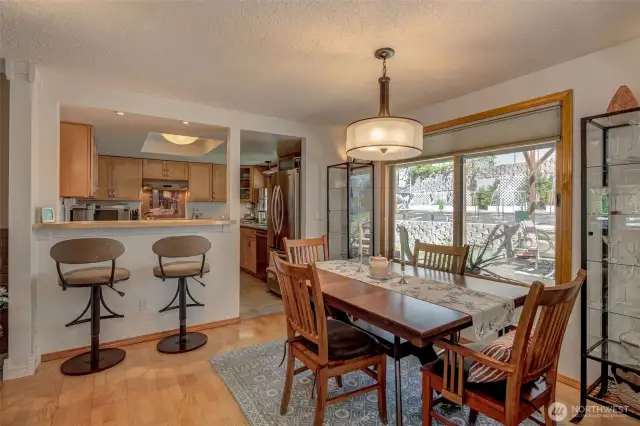 Dining area is spacious and open, with a breakfast bar nearby for entertaining!