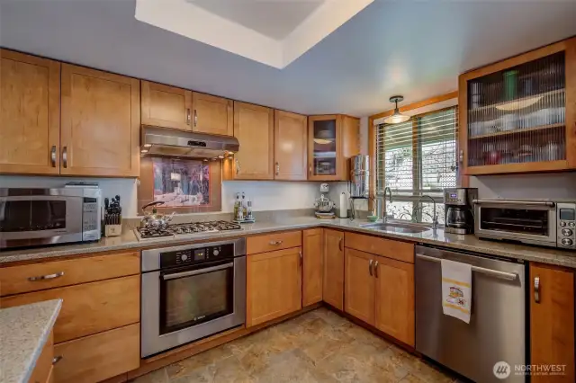 Custom cabinetry, soft-close drawers, quartz, gas range, Bosch appliances, open plan...what more could you want?