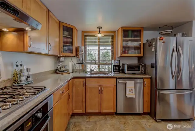 Gorgeous kitchen has ample wraparound counter space for everything you need