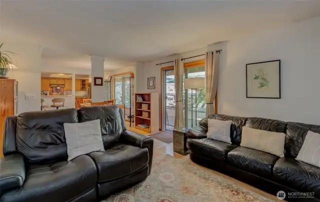 Family room is spacious and open to dining room, kitchen and door to backyard oasis