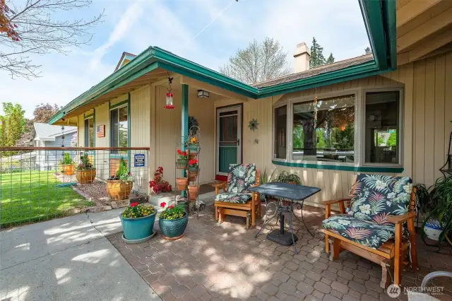 Imagine this charming enclosed patio serving as your welcome greeting!