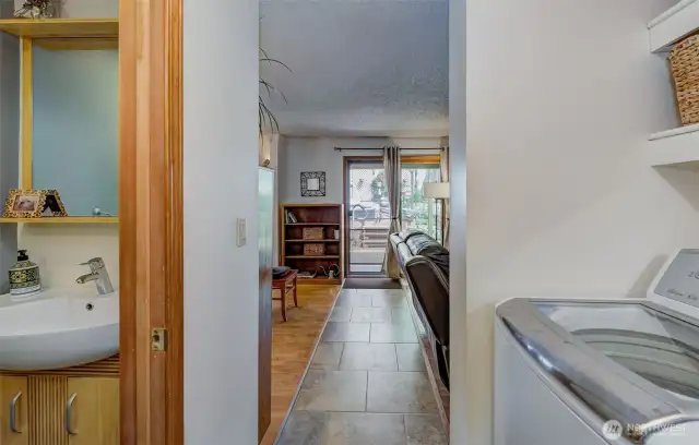 Entry from garage into house... powder room is on the left