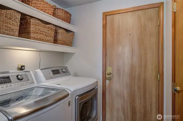 Laundry room has good storage and includes the washer and dryer!