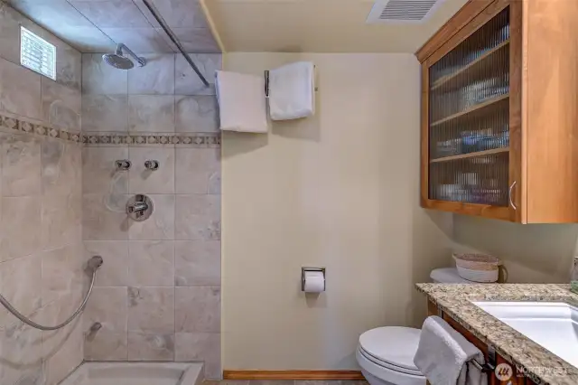 Primary bath has a very spacious walk-in shower with porcelain tile, solid stone base and plumbing for steam shower!