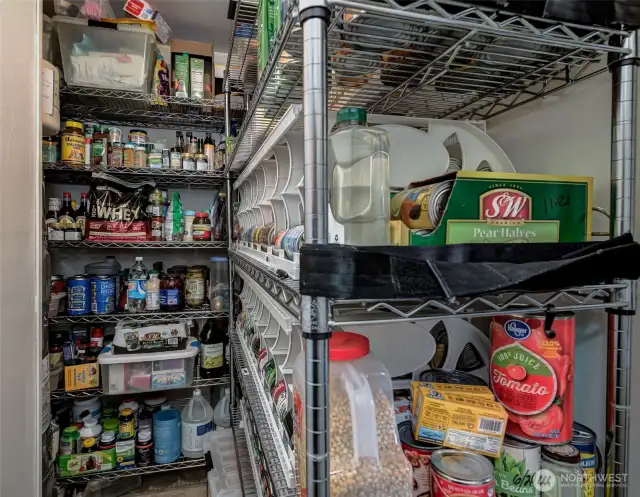 Secret pantry room at the head of the garage! Don't miss it when you tour!